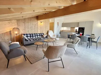 a living room with a couch and chairs and a kitchen at Appartement 3 pièces, 4/6 couchages à Combloux avec parking - FR-1-597-178 in Combloux