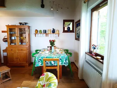 a dining room with a table with a blue table cloth at Le Tavaillon in Saint-Gervais-les-Bains