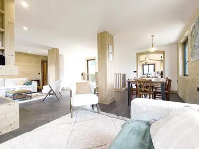 a living room with a couch and a table at Chalet Le Splendide in Saint-Gervais-les-Bains