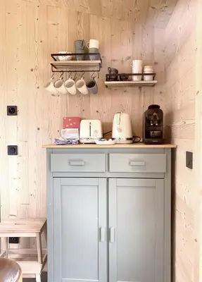 a kitchen with a counter with pots and pans at Chalet Le Splendide in Saint-Gervais-les-Bains