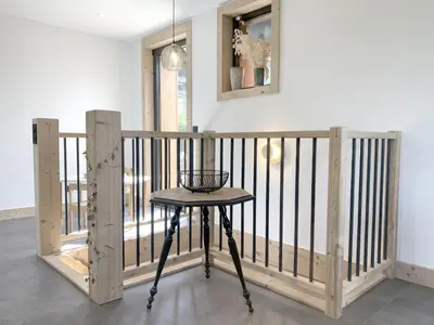 a small table in a room with a balcony at Chalet Le Splendide in Saint-Gervais-les-Bains