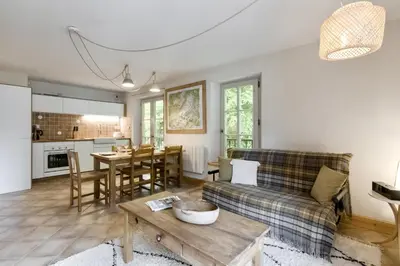a living room with a couch and a table at Le Montagnard in Saint-Gervais-les-Bains