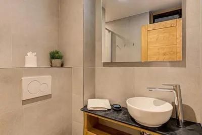 a bathroom with a sink and a mirror at Apartment Cristal des Glaces, Mont Blanc View, Alpes Travel, sleeps 6 in Chamonix-Mont-Blanc