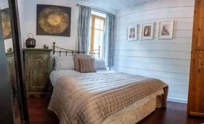 a bedroom with a bed in a room at Heart of Chamonix Lovely and cosy 2 bedrooms, terrace, parking in Chamonix-Mont-Blanc