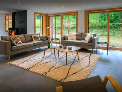 a living room with two couches and a table at Chalet Morris - OVO Network in Sixt