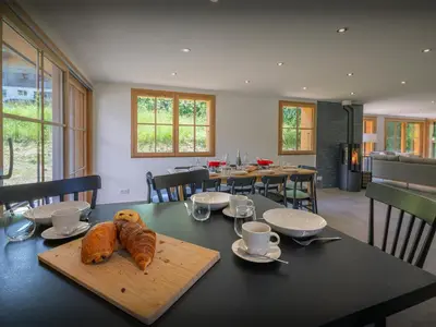 a table with two loaves of bread on top of it at Chalet Morris - OVO Network in Sixt
