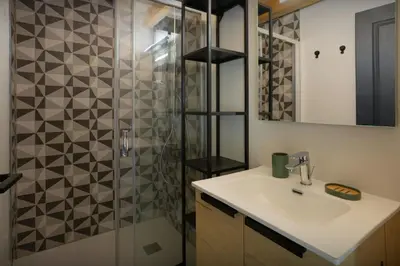 a bathroom with a sink and a shower at MontCriou - OVO Network in Samoëns