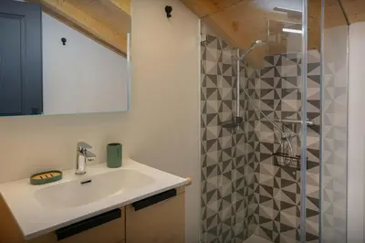 a bathroom with a sink and a shower at MontCriou - OVO Network in Samoëns