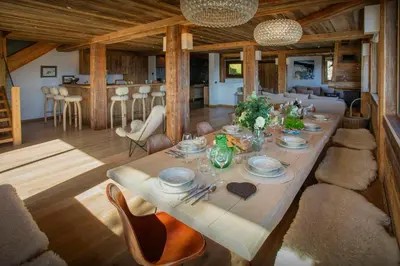 a dining room with a long table in a house at Chalet Vardache - OVO Network in Cordon
