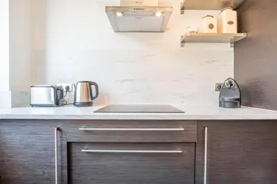 a kitchen with a sink and a counter top at Appt Daisy - Familial - Calme - Vues in Chamonix-Mont-Blanc