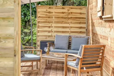 two chairs and a table on a patio at Chalet Marie situé 25km Chamonix in Saint-Gervais-les-Bains