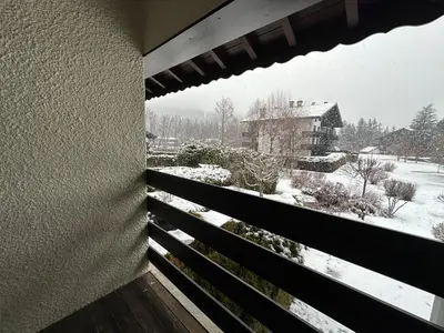 a view of a snow covered yard from a balcony at Alpine Escape Mont Blanc at Your Window in Chamonix-Mont-Blanc