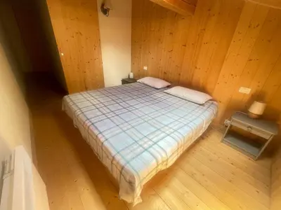 an overhead view of a bed in a wooden room at Alpine Escape Mont Blanc at Your Window in Chamonix-Mont-Blanc