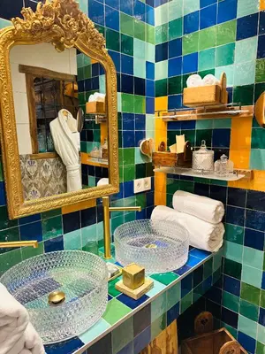 a bathroom with a tub and a sink at Marc VEYRAT in Megève