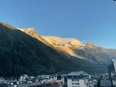 a view of a city with mountains in the background at Magnifique Studio Plein centre vue panoramique in Chamonix-Mont-Blanc