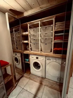 a laundry room with a washer and dryer at La ferme de la Tour - Vallée de Chamonix in Servoz