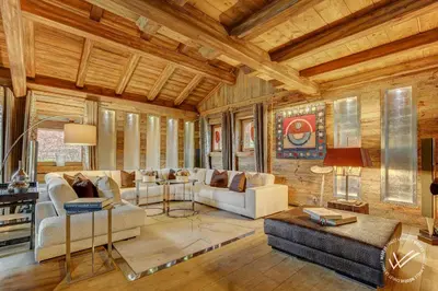 a living room filled with furniture and a wooden ceiling at Mirage in Demi-Quartier