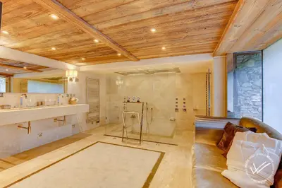 a large bathroom with a shower and a couch at Mirage in Demi-Quartier