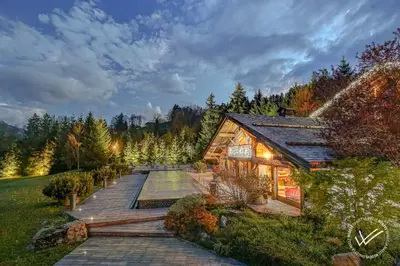 a home with a wooden walkway next to a house at Mirage in Demi-Quartier