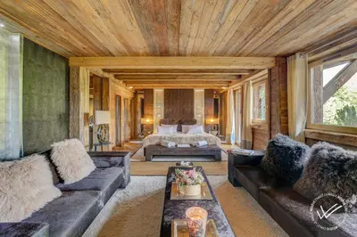 a living room with two couches and a bed at Mirage in Demi-Quartier