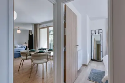 a dining room with a table and chairs in a room at Alpina 108 départ ski & rando depuis le Bettex in Saint-Gervais-les-Bains