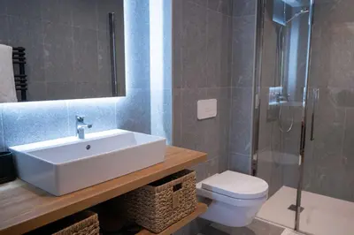 a bathroom with a sink and a toilet and a shower at L'Eclat des Veriaz - Megève Appartement 2 chambres, Résidence de standing in Megève