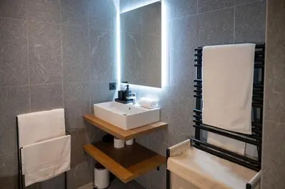 a bathroom with a sink and a mirror at L'Eclat des Veriaz - Megève Appartement 2 chambres, Résidence de standing in Megève