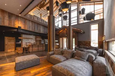 a large living room with couches and a fireplace at L'Eclat des Veriaz - Megève Appartement 2 chambres, Résidence de standing in Megève