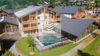 an aerial view of a house with a swimming pool at L'Eclat des Veriaz - Megève Appartement 2 chambres, Résidence de standing in Megève