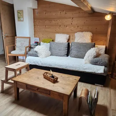 a living room with a couch and a coffee table at Adret1 in Passy