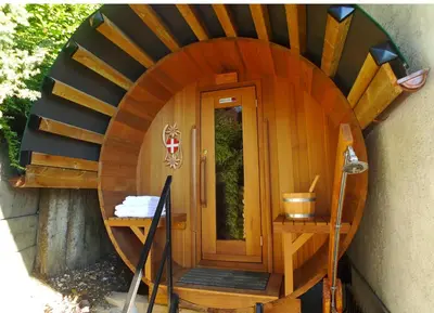 a circular entrance to a house with a wooden door at Location de charme 4 étoiles à Passy in Passy