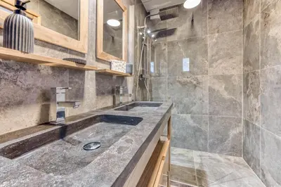 a bathroom with a sink and a shower at Apt 8 pers hyper centre à Chamonix in Chamonix-Mont-Blanc
