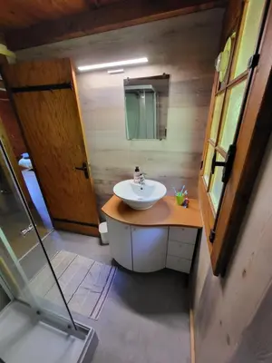 a bathroom with a sink and a mirror at Chalet d'alpage avec vue incroyable in Saint-Gervais-les-Bains