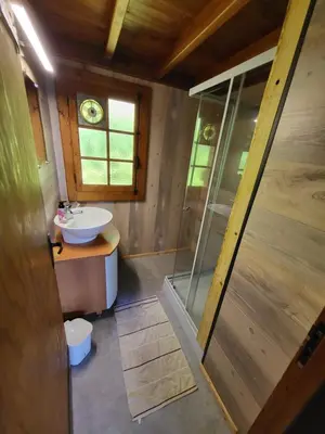 a small bathroom with a sink and a shower at Chalet d'alpage avec vue incroyable in Saint-Gervais-les-Bains