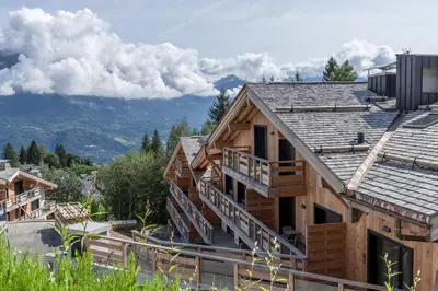 a log cabin with a view of the mountains at Alpage Mont Blanc in Combloux