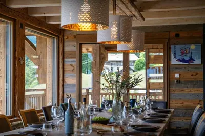 two bunk beds in a room with wooden walls at Chalet K1027 - OVO Network in Cordon
