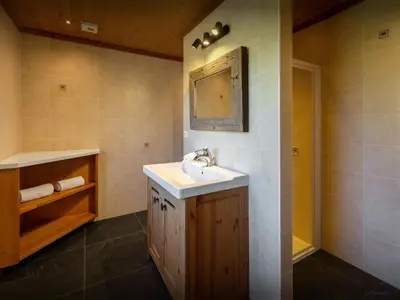 a bathroom with a sink and a mirror at Chalet Nahuel Huapi - OVO Network in Samoëns
