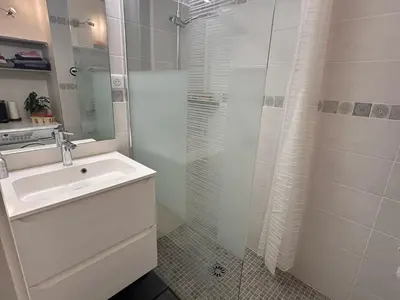 a white bathroom with a sink and a shower at Confortable appartement 3 pièces · Proche des pistes · WIFI · 6 pers - FR-1-425-225 in Arâches-la-Frasse
