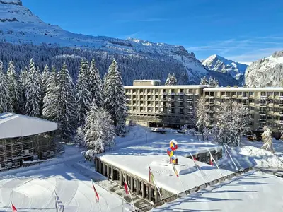 a resort in the snow with snow covered trees and mountains at Confortable appartement 3 pièces · Proche des pistes · WIFI · 6 pers - FR-1-425-225 in Arâches-la-Frasse