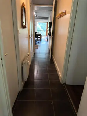 a hallway with a tile floor in a house at Résidence Cassiopee - Appartement tout confort · proche des pistes · WIFI gratuit · vue pistes MAE-0471 in Magland