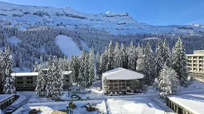 a resort with snow covered trees and a mountain at Résidence Cassiopee - Appartement tout confort · proche des pistes · WIFI gratuit · vue pistes MAE-0471 in Magland