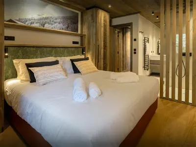 a large white bed with two white pillows on it at Chalet Mussol - OVO Network in Saint-Gervais-les-Bains