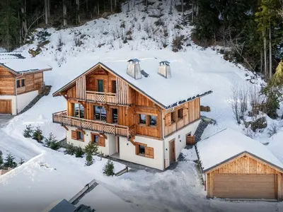 an aerial view of a log home in the snow at Chalet Mussol - OVO Network in Saint-Gervais-les-Bains
