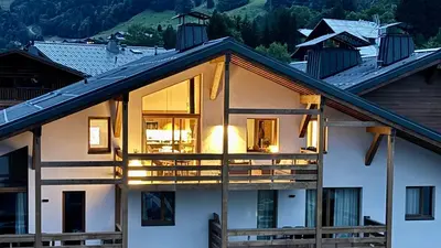 a house with large windows and a roof at Flocons de Megève in Megève