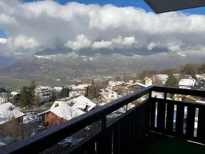 a view of a snowy mountain from a balcony at Appartement centre Saint Gervais-Vue imprenable in Saint-Gervais-les-Bains