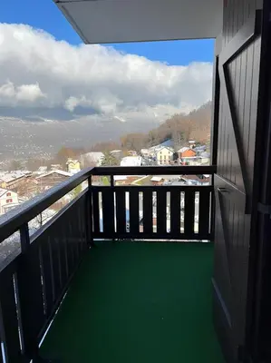 a balcony with a view of a city at Appartement centre Saint Gervais-Vue imprenable in Saint-Gervais-les-Bains