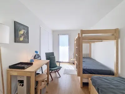 a bedroom with a desk and a bunk bed at Appartement 3 pièces avec balcon et parking à Combloux - FR-1-560-146 in Combloux