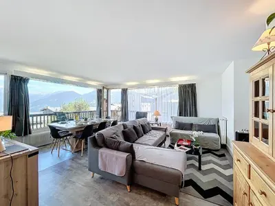 a living room with a couch and a table at Appartement 3 pièces avec balcon et parking à Combloux - FR-1-560-146 in Combloux