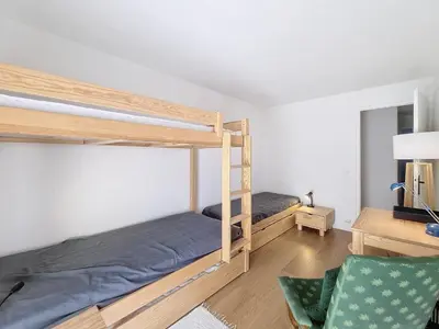 a bedroom with two bunk beds and a desk at Appartement 3 pièces avec balcon et parking à Combloux - FR-1-560-146 in Combloux