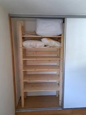 a closet with wooden shelves and a desk at T3 avec vue montagne in Les Contamines-Montjoie